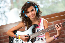 Cute Girl At Guitar Practice.