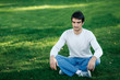 © paffy - Relaxed man sitting in lotus position with closed eyes