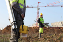 Surveyors On A Construction Site