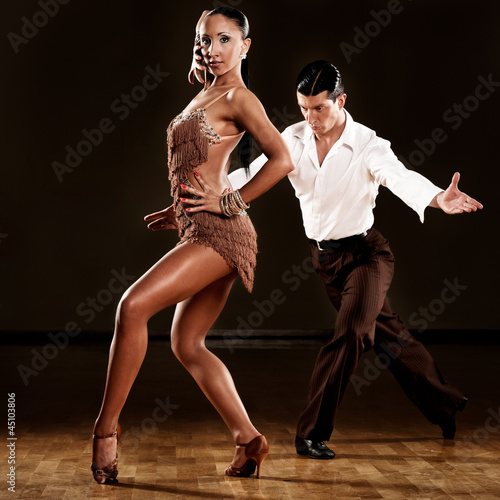 latino dance couple in action - 45103806