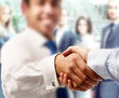 © lenets_tan - Closeup of a business handshake, isolated on white