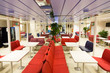 Lounge inside a ferry with rows of chairs