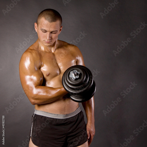 Muscled Male Bodybuilder Dumbbell Swing Buy This Stock
