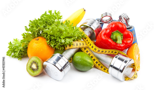 Fototapeta na wymiar fitness dumbbells, fruits and measure tape