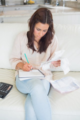 Wall Mural - Woman calculating receipts