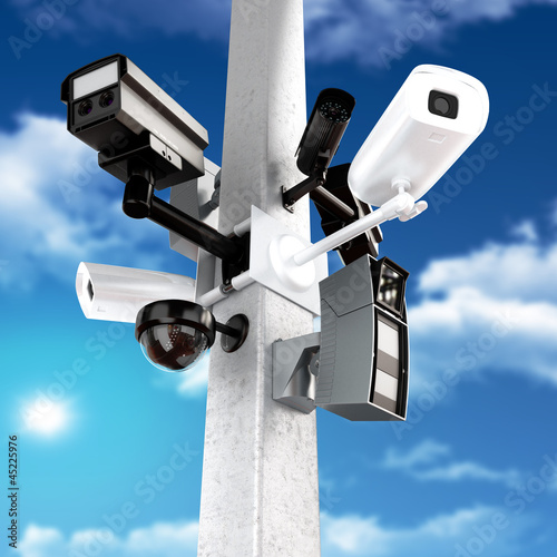Fotografie, Obraz Surveillance mega camera's concept with a sky background
