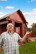 © DariaTrofimova - man  pointing to house