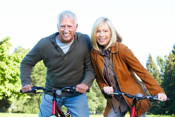 Canvas Print - Happy senior couple cyclist.