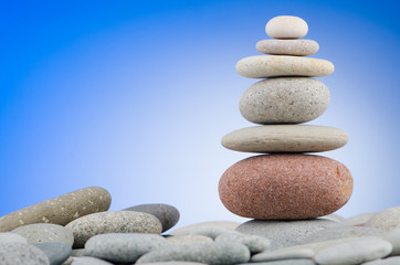 Pebbles stack against gradient background