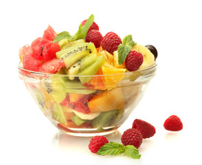 Wall Mural - fresh fruits salad in bowl  and berries, isolated on white