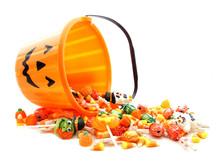 Halloween Jack-o-lantern Pail With Spilling Candy Over White