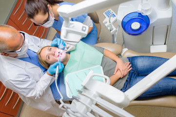 Wall Mural - At the dentist patient lying dental chair