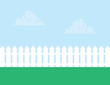White picket fence with cloudy sky