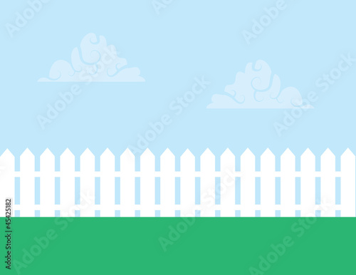 Fotografía White picket fence with cloudy sky