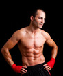 © cristovao31 - Young Boxer fighter over black background