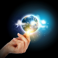 Wall Mural - hand touching the earth