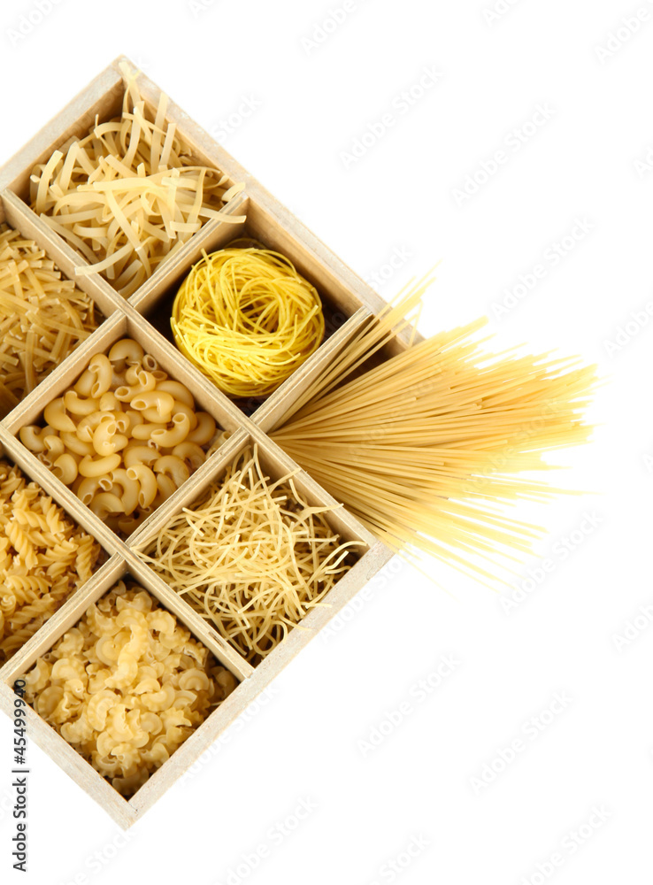 Nine types of pasta in wooden box sections isolated on white