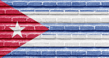 Wall Mural - Cuba flag on an old brick wall