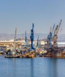 Fototapeta Miasto - Cranes in a shipyard