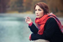 Pretty Girl Smoking In Autumn
