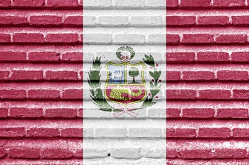 Wall Mural - Peru flag on an old brick wall