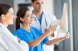 © michaeljung - group of medical workers working together in hospital