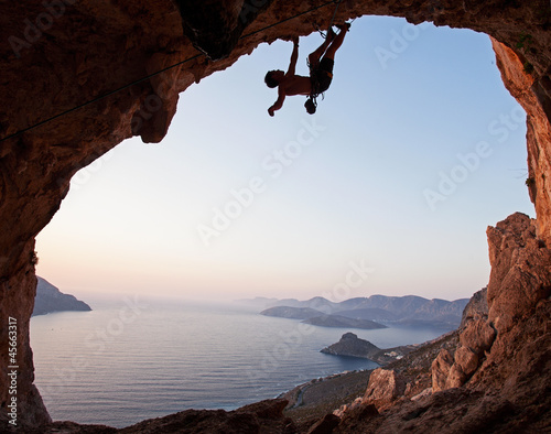 Naklejka na kafelki Silhouette of a rock climber at sunset, Kalymnos Island, Greece