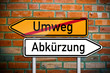 © Stockwerk-Fotodesign - Wegweiser mit Umweg und Abkürzung