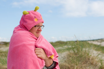 Freezing man with pink towel