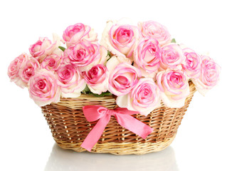 Wall Mural - beautiful bouquet of pink roses in basket, isolated on white