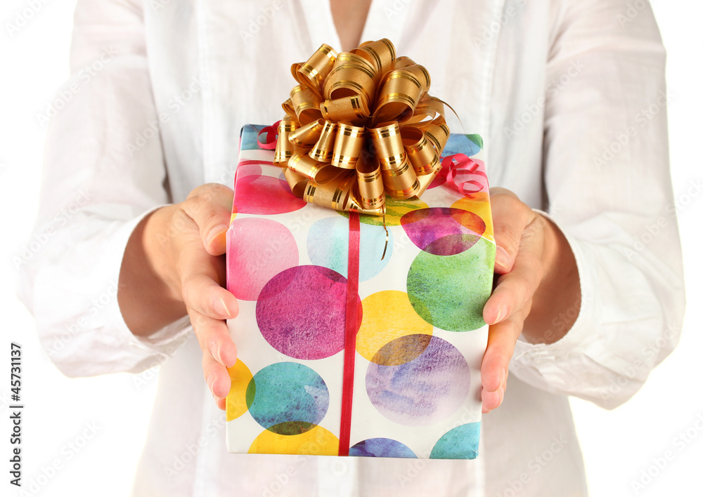 woman holds a box with a gift on white background close-up