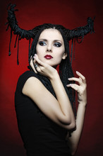 Beautiful Woman In Carnival Costume. Witch Shape With Horns.