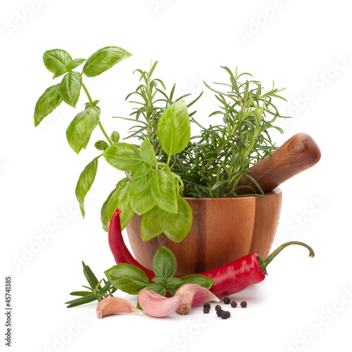 Naklejka na drzwi fresh flavoring herbs and spices in wooden mortar