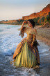 beautiful girl in a vintage dress at the sea