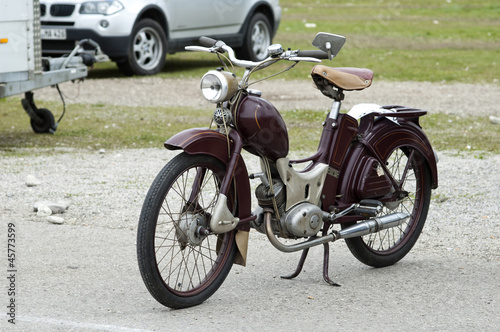 Vintage old retro brown motorbike staying on the street © Garlezki
