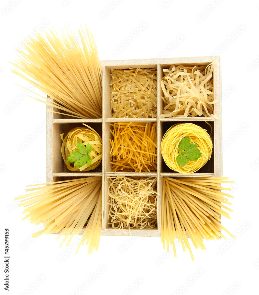 Nine types of pasta in wooden box sections isolated on white
