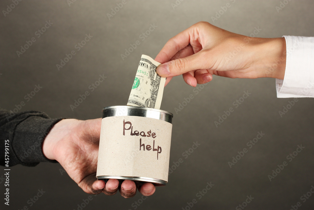 helping the homeless, on black background close-up