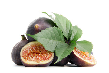 Ripe sweet figs with leaves isolated on white