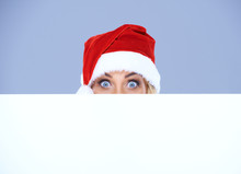 Woman Head And Eyes With Santa Hat Above White Board
