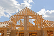 New Residential Construction Home Framing Against A Blue Sky