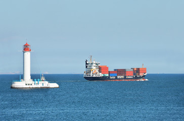 Cargo ship near lighthouse in Odessa, Ukraine