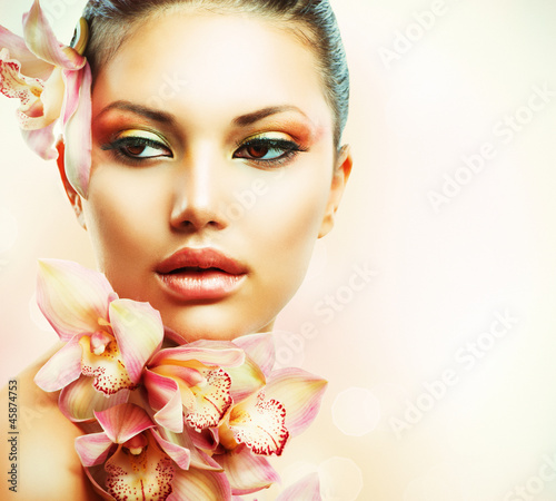 Naklejka na szybę Beautiful Girl With Orchid Flowers. Beauty Woman Face