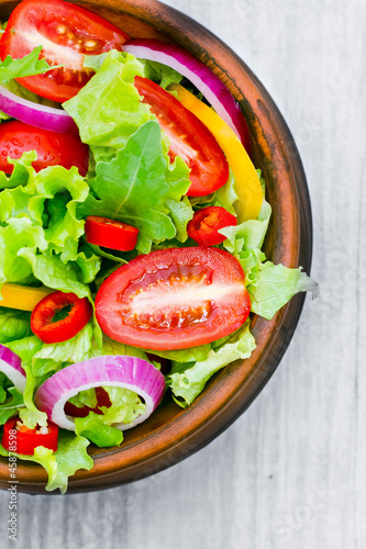 Fotografie, Obraz Fresh Salad in a bowl on wooden background