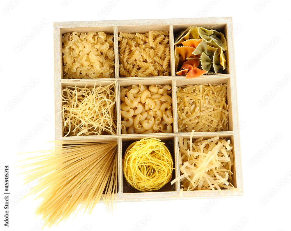 Nine types of pasta in wooden box sections isolated on white