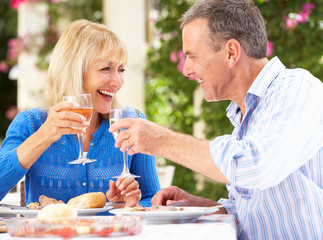 Wall Mural - Senior Couple Enjoying Meal outdoorss