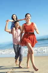 Wall Mural - Family Having Fun On Beach