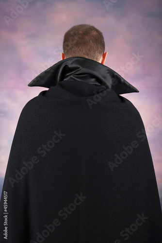Photographie portrait of a handsome young man in a suit of Count Dracula