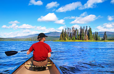 Wall Mural - Canoeing on a lake in the wilderness of British Columbia, Canada