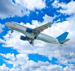 Passenger airplane against blue sky