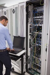 Poster - Man repairing servers